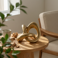 Tabletop Sculpture with Curved Loop Gold Abstract Loop Statue Elegant Curved Sculpture for Living Room