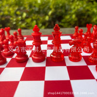 Red and White Checkered Chess Board 24cm with Pieces