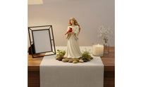 Angel Holding Cardinal Figurine Symbol of Love and Comfort for Mantelpiece