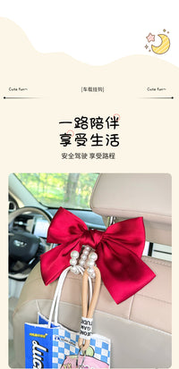 车载座椅挂钩蝴蝶结椅背多功能珍珠挂钩后排置物便捷隐藏车载挂勾
