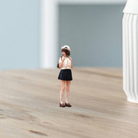 Miniature Woman Figurine White Hat Hand-Painted Figurine Small Backpack Lady Miniature Figure