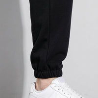 Mens Tracksuit Bottoms with Fleece Lined Interior for Winter Warmth, Tapered Joggers with Elastic Waist and Ankle Cuffs