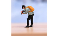 Orange Backpack Bending Male Figurine Light Blue Top Collectible Figure Display Piece for Collectors