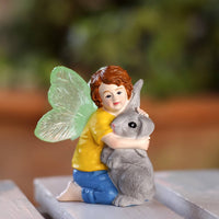 Boy Fairy Hugging Rabbit Statue Illuminate in the Dark Fairy Boy with Rabbit