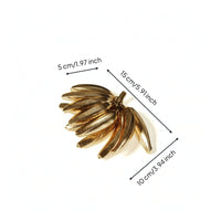 Metal Banana decor Golden Finish-Toned Banana Sculpture Shiny Tabletop Ornament for Coffee Table, Desk, Reading Corner