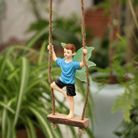 Swinging Boy Fairy Figurine Weather Resistant Resin Boy Fairy on a Swing Handcrafted Look Glow in the Dark Ornament for Gardeners, Balcony