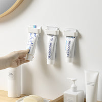 Minimalist Punch-Free Bathroom Wall-Mounted Toothpaste and Facial Cleanser Holder Clip