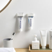 Minimalist Punch-Free Bathroom Wall-Mounted Toothpaste and Facial Cleanser Holder Clip