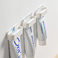 Minimalist Punch-Free Bathroom Wall-Mounted Toothpaste and Facial Cleanser Holder Clip