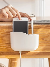 Wall-Mounted Remote Control and Phone Holder with Charging Port