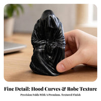 Compact Hooded Figure Sculpture