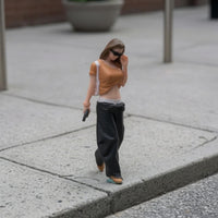 Hand-Painted Resin Figurine Dark Pants Walking Woman Figurine Phone Accessory