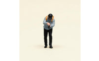 Orange Backpack Bending Male Figurine Light Blue Top Collectible Figure Display Piece for Collectors