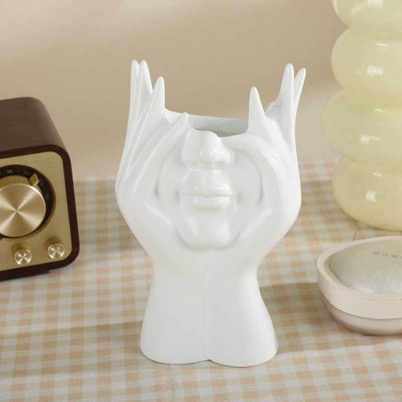 White / Holding Face