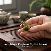 Brass elephant figurine, durable decor.